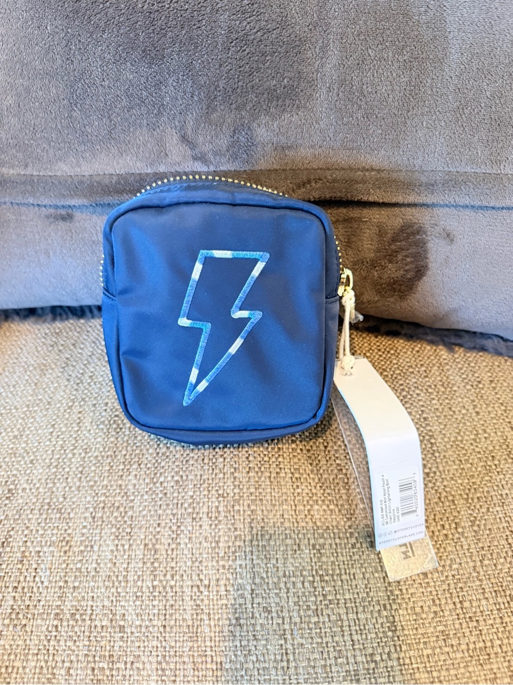 NWT Stoney clover lane sapphire mini pouch with lightning bolt embroidery.